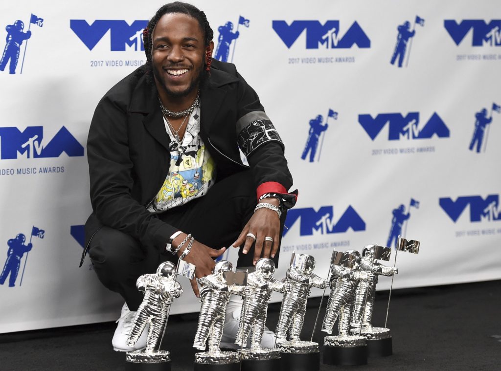 Kendrick Lamar poses in the press room with the awards for best hip hop video, best direction, best cinematography, best art direction, best visual effects, and video of the year for "HUMBLE." at the MTV Video Music Awards at The Forum on Sunday, Aug. 27, 2017, in Inglewood, Calif. (Photo by Jordan Strauss/Invision/AP)