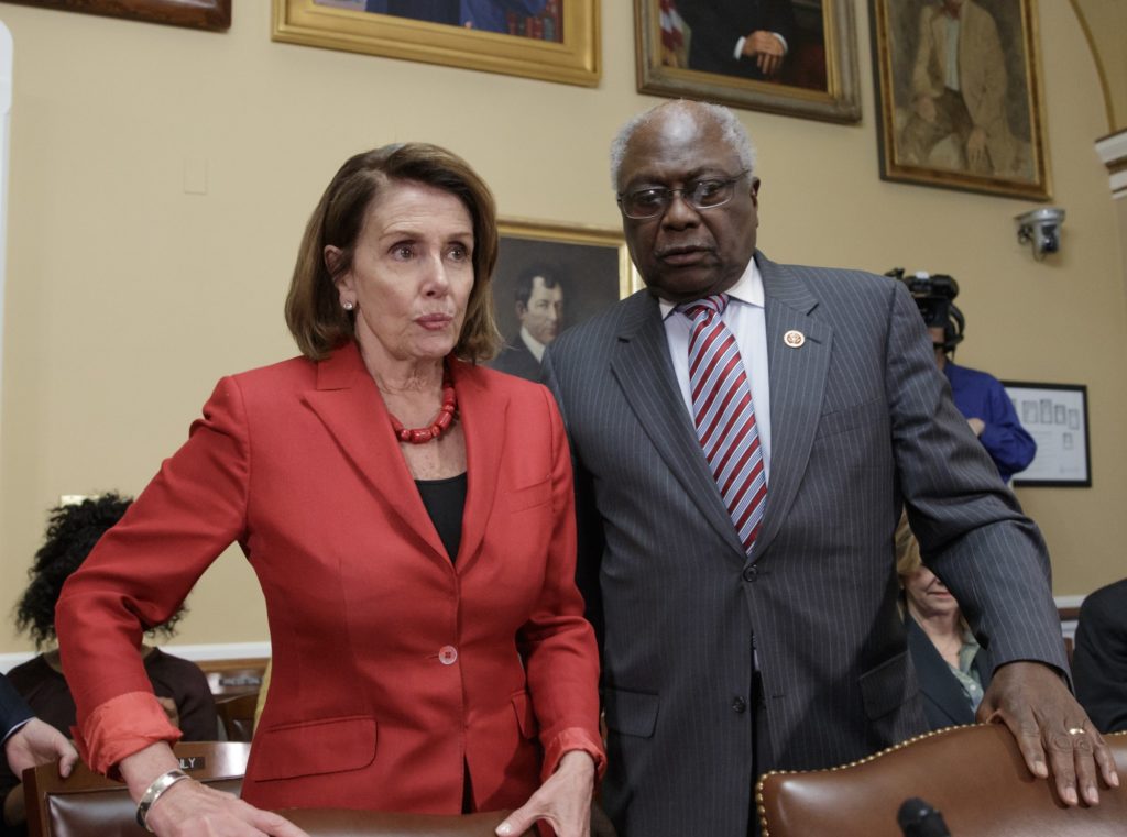 House Democratic Leader Nancy Pelosi of California, with Assistant Minority Leader Rep. James Clyburn, D-S.C., right, arrives at the House Rules Committee to speak in support of AARP and other consumer health groups as the GOP majority is shaping the final version of the Republican health care bill before it goes to the floor for debate and a vote, at the Capitol in Washington, Wednesday, March 22, 2017.  (AP Photo/J. Scott Applewhite)