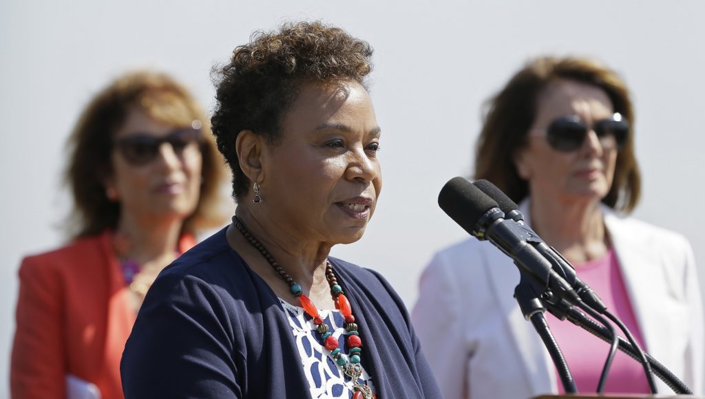Congresswoman Barbara Lee, center, speaks during an event to commemorate Women's Equality Day Tuesday, Aug. 22, 2017, in San Francisco. The event also celebrated the launch of the Democrats' economic agenda, "A Better Deal: Better Wages, Better Future." In the background at left is Congresswoman Jackie Speier and at right is House Minority Leader Nancy Pelosi. (AP Photo/Eric Risberg)