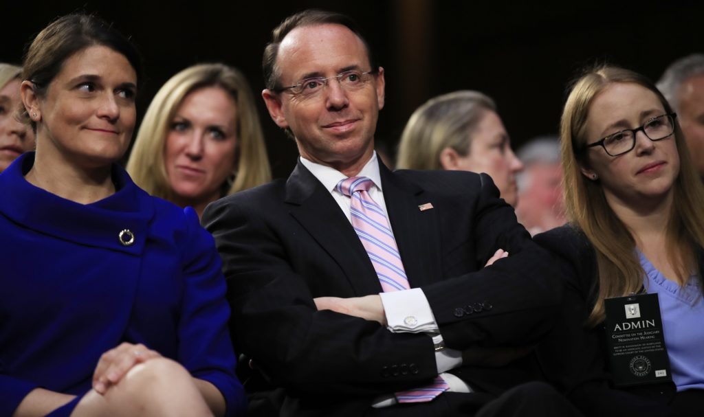 Deputy Attorney General Rod Rosenstein, center, listens to lawmakers speak during a during a Senate Judiciary Committee's nominations hearing on Supreme Court nominee Brett Kavanaugh, on Capitol Hill in Washington, Tuesday, Sept. 4, 2018. (AP Photo/Manuel Balce Ceneta)