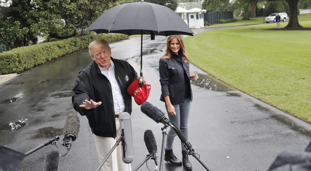 President Donald Trump and first lady Melania Trump walk across the South Lawn of the White House in Washington, Monday, Oct. 15, 2018, to board Marine One helicopter for a short trip to Andrews Air Force Base, Md., en route to Florida to tour areas the devastation left behind from Hurricane Michael last week. (AP Photo/Pablo Martinez Monsivais)