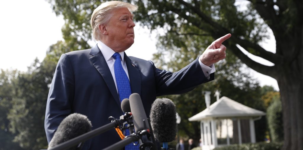 President Donald Trump walks across the South Lawn of the White House in Washington, Tuesday, Oct. 2, 2018, to board Marine One helicopter for a short trip to Andrews Air Force Base, Md., en route to Philadelphia. (AP Photo/Pablo Martinez Monsivais)