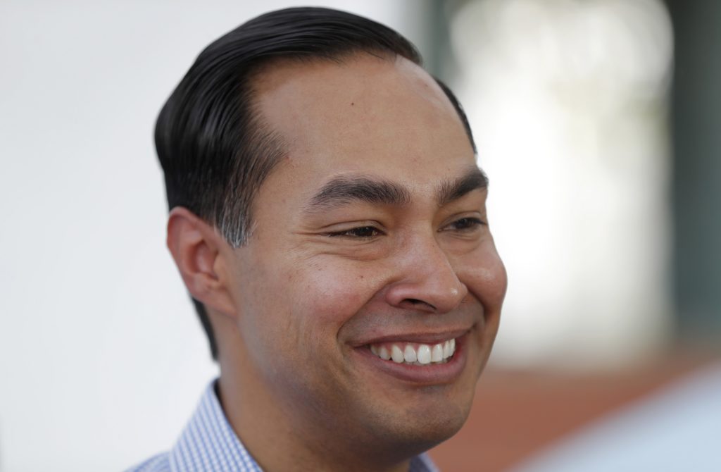 FILE - In this Aug. 17, 2018 file photo, former Housing and Urban Development Secretary Julian Castro speaks to reporters during a visit to the Iowa State Fair in Des Moines, Iowa. Castro, a Democrat, says he'll "likely" seek the presidency in 2020 after months of signs that former President Barack Obama's housing secretary is preparing for a White House run. Castro told The Associated Press on Tuesday, Oct. 16, 2018, that the Democratic nomination is a wide-open race and says voters are open to considering new faces. (AP Photo/Charlie Neibergall File)