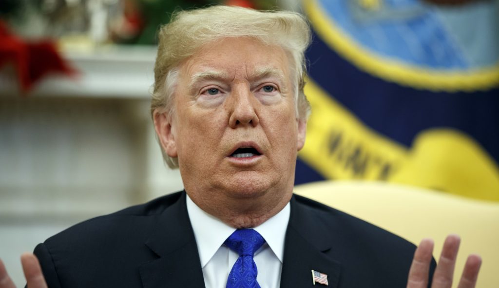 In this Dec. 11, 2018 photo, President Donald Trump speaks during a meets with Democratic leaders the Oval Office in Washington. Against the advice of many in his own administration, Trump is pulling U.S. troops out of Syria. But the abruptness with which Trump is turning the page on Syria is raising questions about whether he might not do the same in Iraq or Afghanistan. (AP Photo/Evan Vucci)