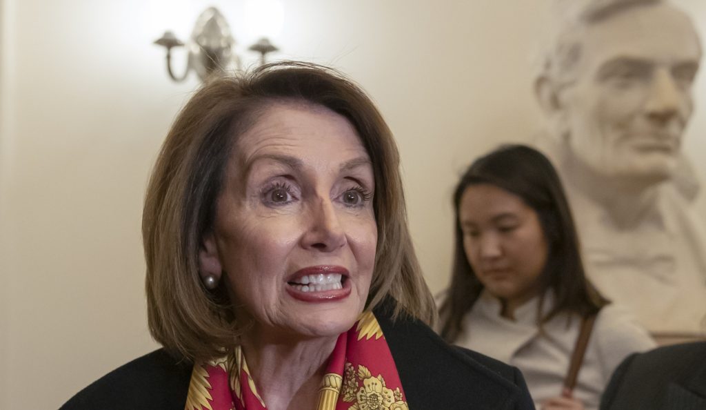 Speaker of the House Nancy Pelosi, D-Calif., responds to reporters after officially postponing President Donald Trump's State of the Union address until the government is fully reopened, at the Capitol in Washington, Wednesday, Jan. 23, 2019. The California Democrat told Trump in a letter Wednesday the Democratic-controlled House won't pass the required measure for him to give the nationally televised speech from the House floor. (AP Photo/J. Scott Applewhite)