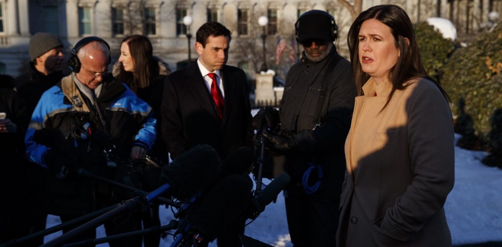White House press secretary Sarah Huckabee Sanders talks with reporters outside the White House, Wednesday, Jan. 16, 2019, in Washington. (AP Photo/ Evan Vucci)