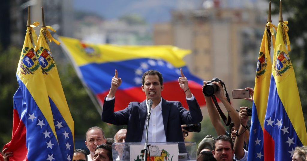 Juan Guaido, head of Venezuela's opposition-run congress, declares himself interim president of the nation until elections can be held during a rally demanding President Nicolas Maduro's resignation in Caracas, Venezuela, Wednesday, Jan. 23, 2019. (AP Photo/Fernando Llano)