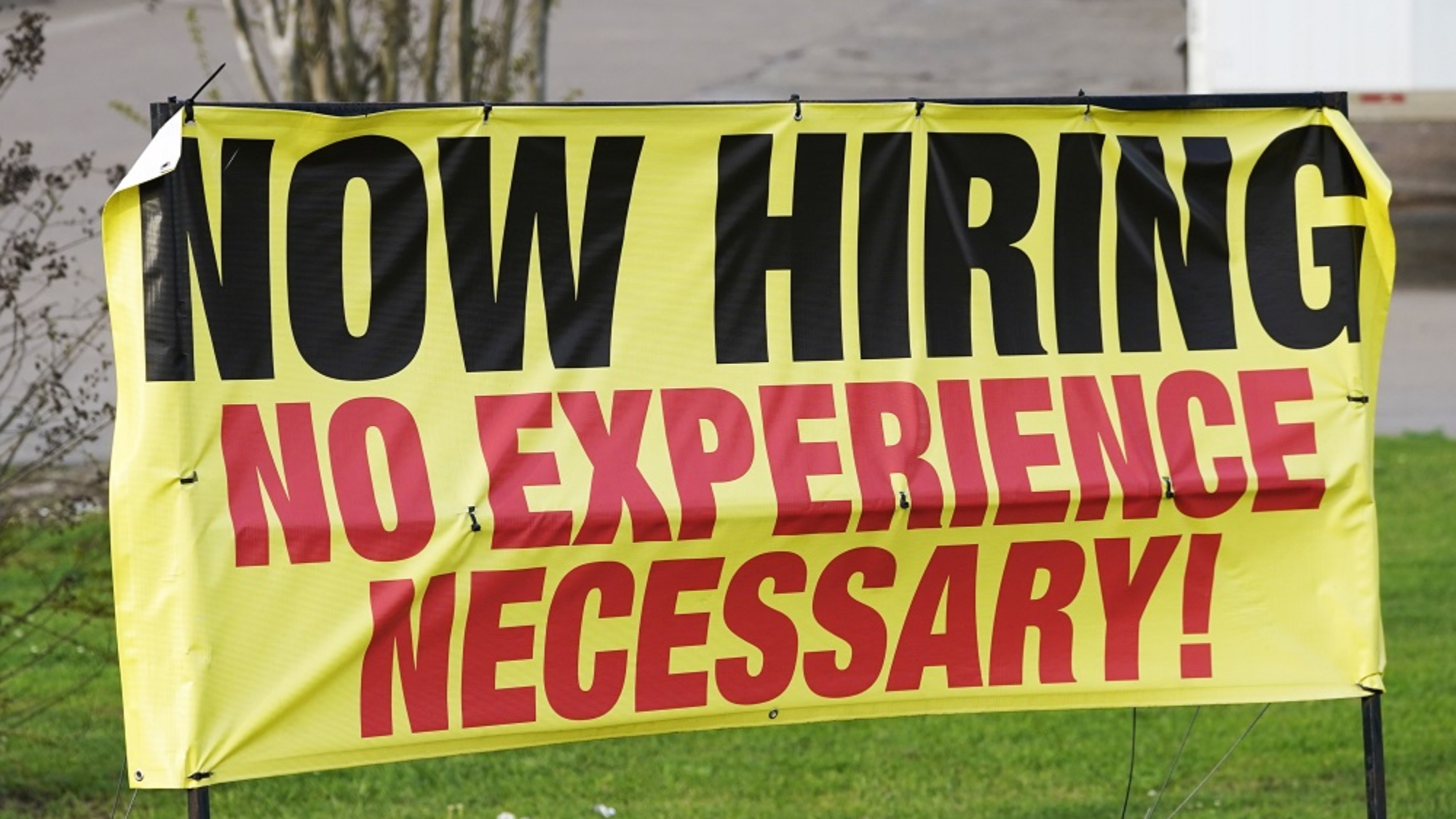 A roadside banner beckons potential employees outside Channel Control Merchants LLC, an extreme value retailer and exporter of brand sensitive secondary market inventories, in Hattiesburg, Miss., March 27, 2021. (AP Photo/Rogelio V. Solis)