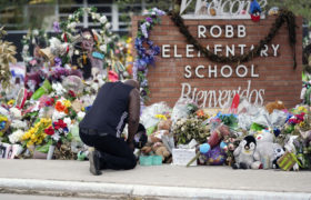 Reggie Daniels pays his respects at a memorial at Robb Elementary School in Uvalde, Texas, on June 9, 2022